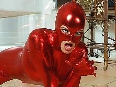 Flexible Angie with eyes of a cat walks like a feline in her red-blood spandex suit.