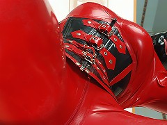 Voluptuous blonde Katka poses in black and red rubber suit with full view of her huge boobs!