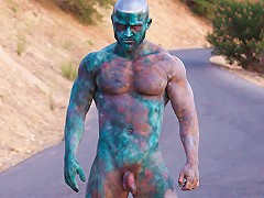 A lone hulking creature (international adult star and model, Francois Sagat) emerges from the depths of the Pacific Ocean.