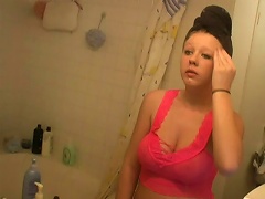 Go behind the scenes and witness this young whore bitch putting on make-up after taking a soothing bath. See her take t