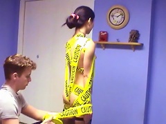 This amazing Asian slut is dangerously seductive in bed so she is wrapped with a yellow caution tape. See her g