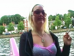 Taking to the river itself in a peddalo, Donna masterbates openly with a dildo as other boats