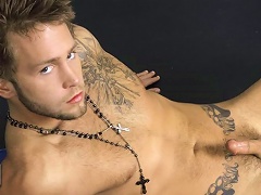 CJ Crawford shows off his lightly furry tattooed body while stroking his rock hard coc