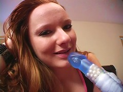 This redhead bitch demonstrates how she sucks a cock with this toy. See her lick its head as well as its shaft. Watch as she tak